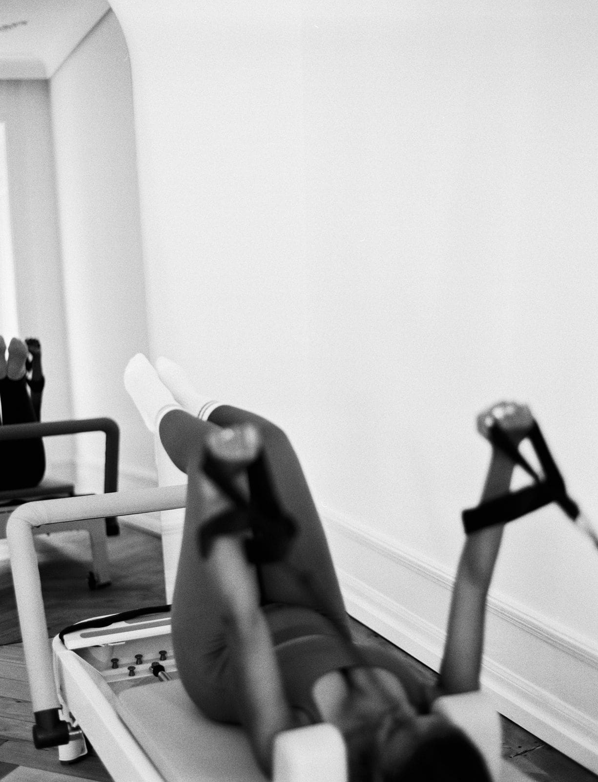 Strength-focused movement during Reformer Pilates Zurich class
